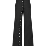 Siyah metal düğmeli yırtmaçlı bol pantolon