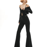 Siyah düşük omuzlu açık yaka ispanyol paça tulum