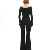 Siyah düşük omuzlu açık yaka ispanyol paça tulum