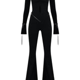 Siyah düşük omuzlu açık yaka ispanyol paça tulum