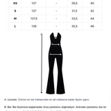 Siyah derin v yaka dekolteli ispanyol paça tulum