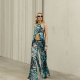 WHO IS SHE TOP IN GREEN ANIMAL PRINT