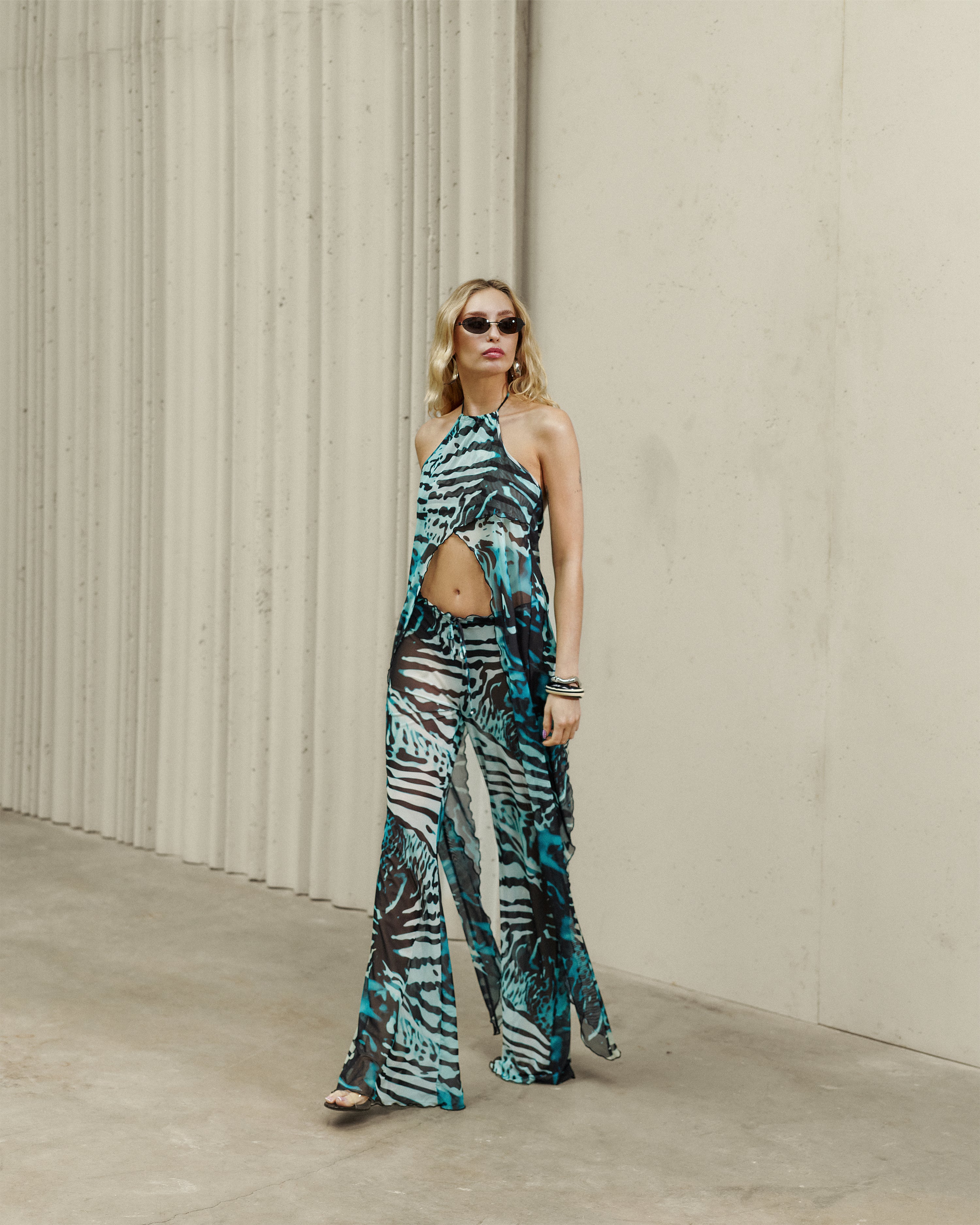 WHO IS SHE TOP IN GREEN ANIMAL PRINT