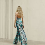 WHO IS SHE TOP IN GREEN ANIMAL PRINT